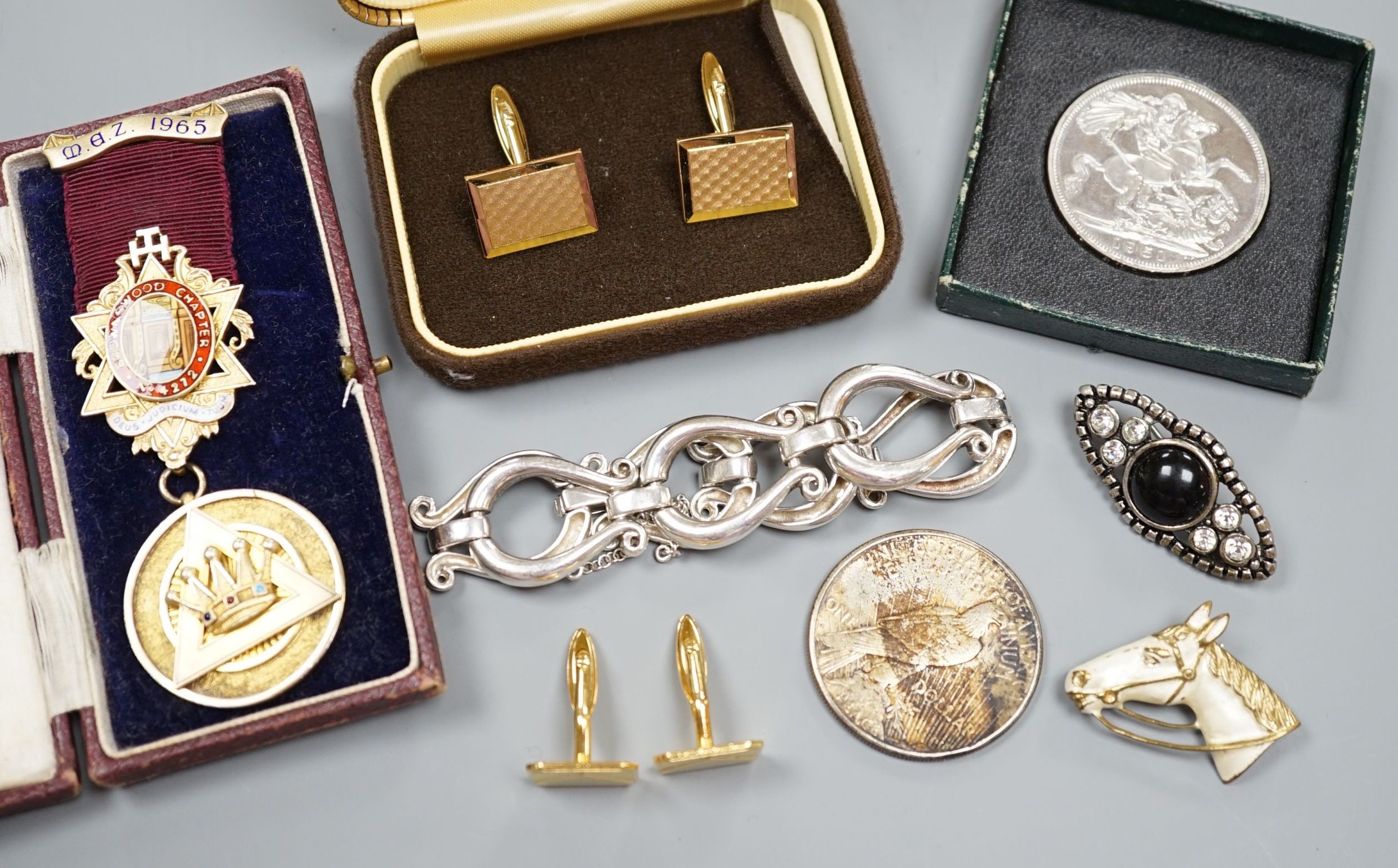 A white metal bracelet and minor jewellery and coins.